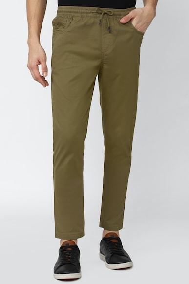 men brown solid carrot fit casual trousers