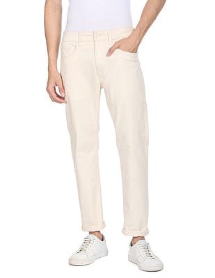 men cream mid rise solid casual trousers