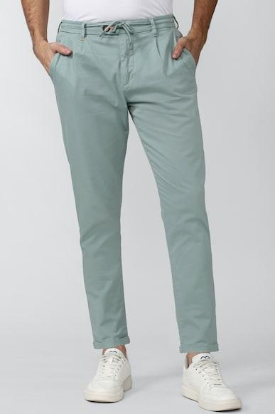 men green solid carrot fit casual trousers