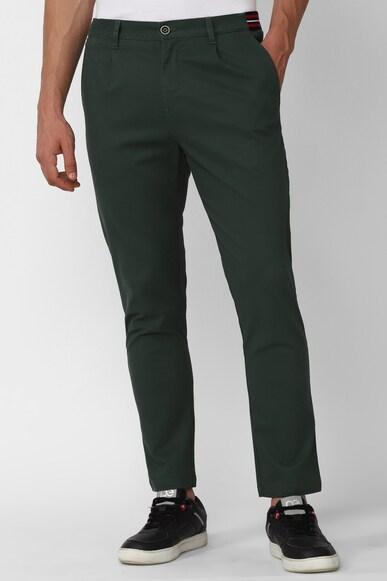 men green solid carrot fit casual trousers