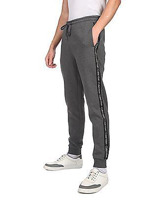 men grey mid rise brand tape joggers