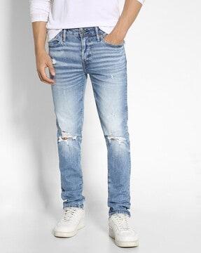 men heavily washed distressed slim fit jeans