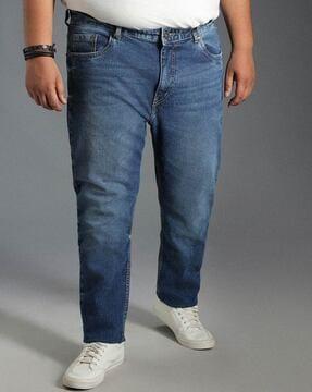 men heavily washed tapered jeans