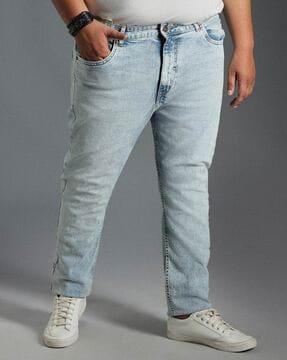 men heavily washed tapered jeans