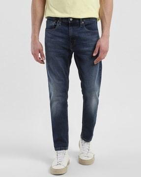 men lightly washed 512 tapered fit jeans