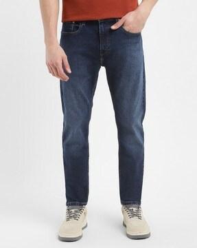 men lightly washed 512 tapered fit jeans