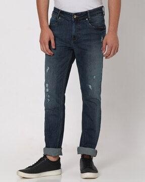 men lightly washed slim fit distressed jeans