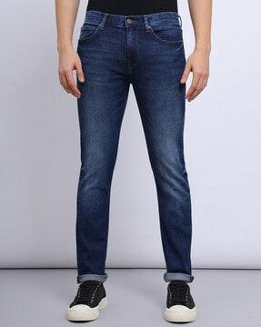 men lightly washed tapered fit jeans