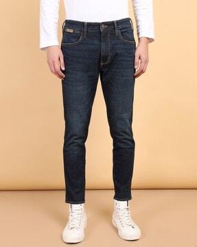 men lightly washed tapered jeans