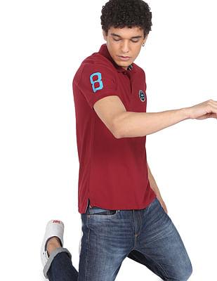 men maroon solid pique polo shirt