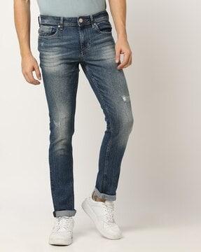 men mid-wash distressed skinny fit jeans