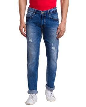 men mid-wash distressed tapered fit jeans