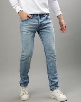 men mid-wash slim jeans