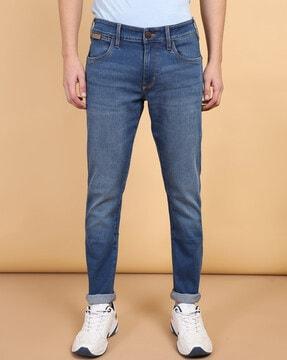 men mid wash tapered fit jeans