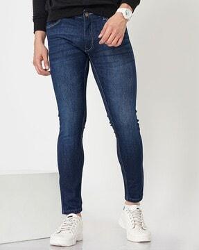 men mid-wash tapered fit jeans