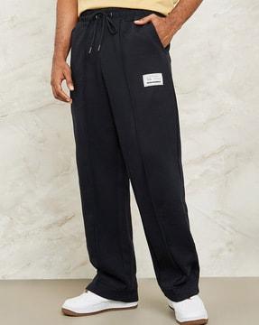 men pintuck wide-leg joggers with badge detail