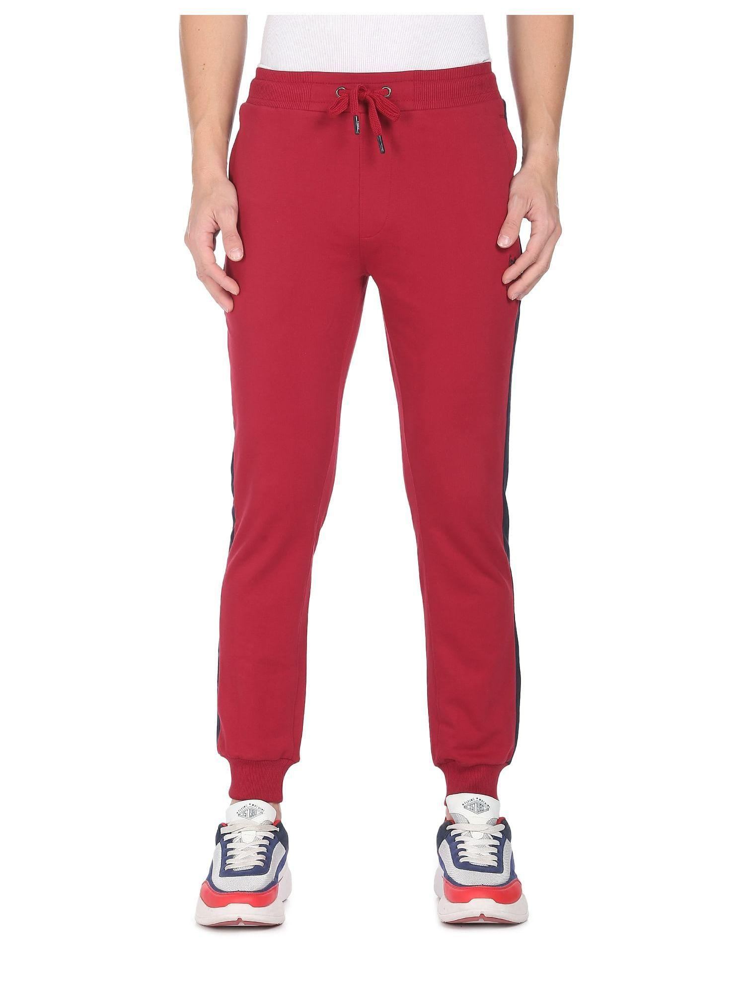 men red mid rise solid joggers