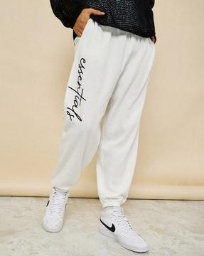 men slogan print oversized joggers with slip pocket