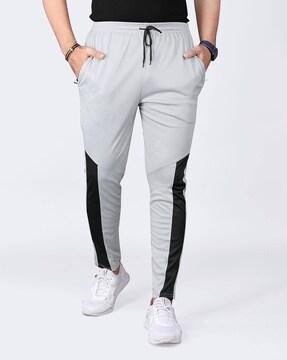 men striped track pants with insert pockets