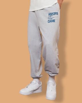 men thigh placement print oversize joggers with elasticated hem