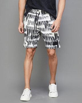 men typographic print regular fit bermuda shorts