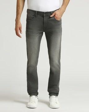 men vapour heavily washed tapered fit jeans