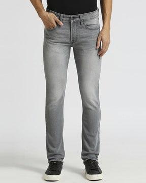 men vapour heavily washed tapered fit jeans