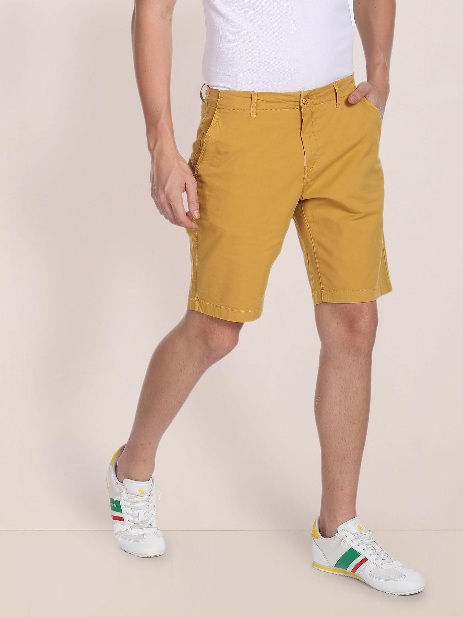 men yellow mid rise solid slim fit shorts