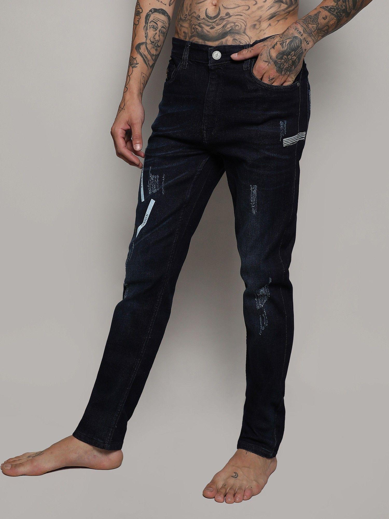 mens dark wash distressed denim jeans with embroidered details