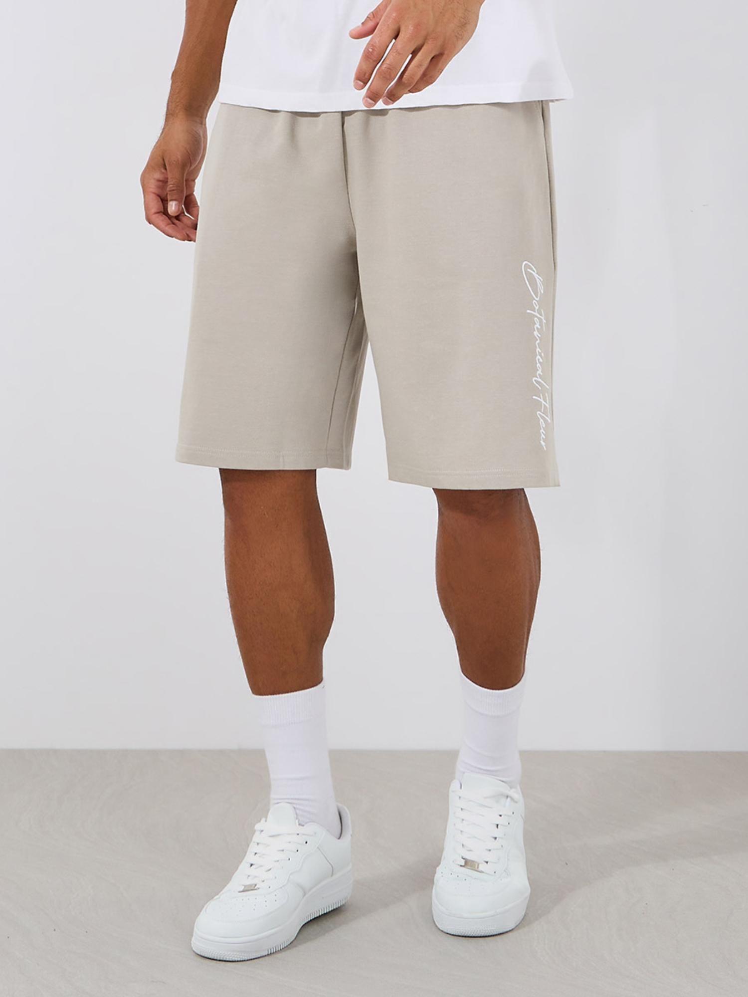mens beige slogan print oversized cotton terry shorts