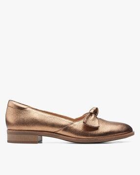 metallic leather slip-on shoes with knotted accent