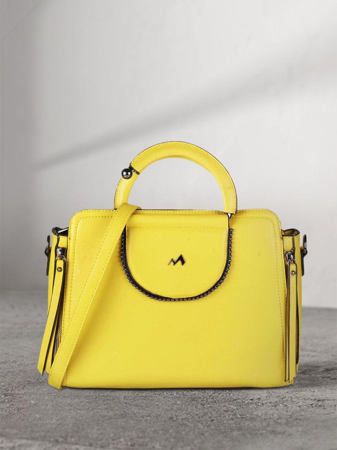 metro women yellow structured handheld bag with tassels