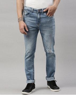 mid distress slim jeans with 5-pocket styling