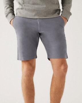 mid- rise flat-front shorts