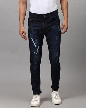 mid-distressed straight jeans with applique