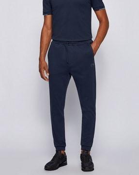 mid-rise flat-front joggers with elasticated drawstring waist