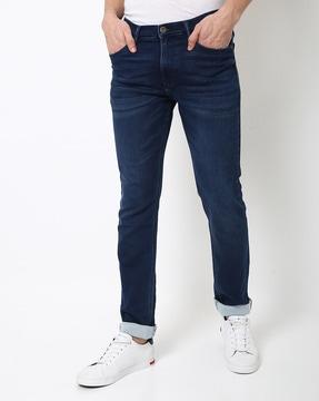 mid-rise slim fit jeans with whiskers