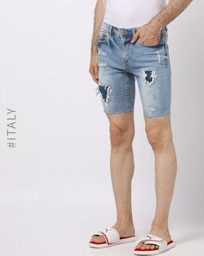 mid-rise distressed denim shorts