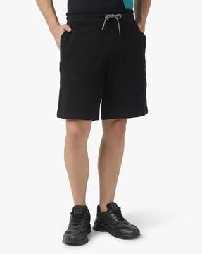 mid-rise flat-front bermuda shorts