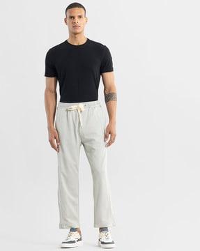 mid-rise relaxed fit pants with drawstring waist