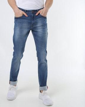 mid-rise slim fit washed jeans with whiskers