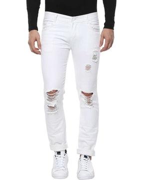 mid-rise slim jeans with heavy distress