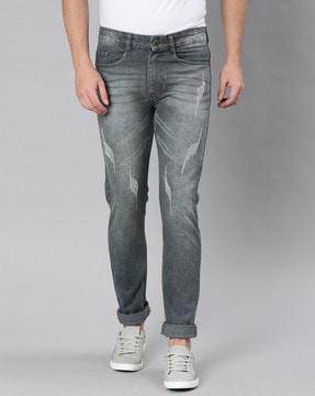 mid-rise slim jeans with light distress