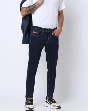 mid-rise slim tapered fit jeans