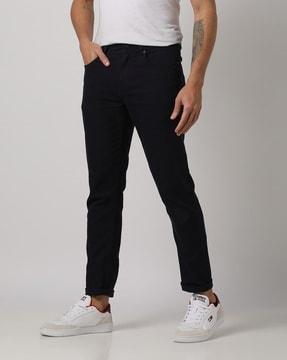 mid-rise slim tapered fit jeans