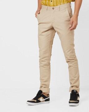 mid-rise tapered fit pants with insert pockets