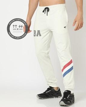 mid-rise track pants with placement prints