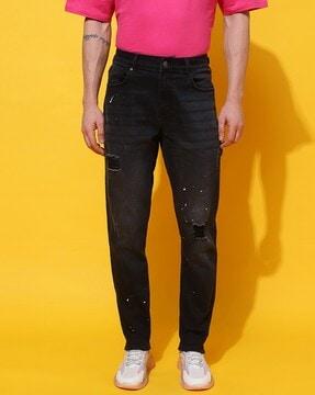 mid-wash distressed tapered jeans