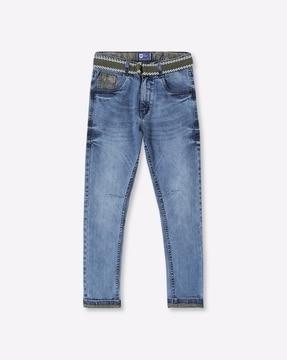 mid-wash jeans with belt
