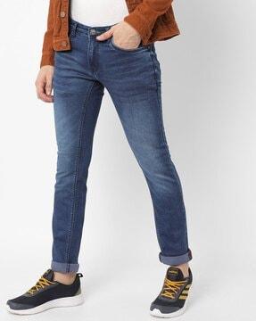mid-wash mid- rise skinny fit jeans